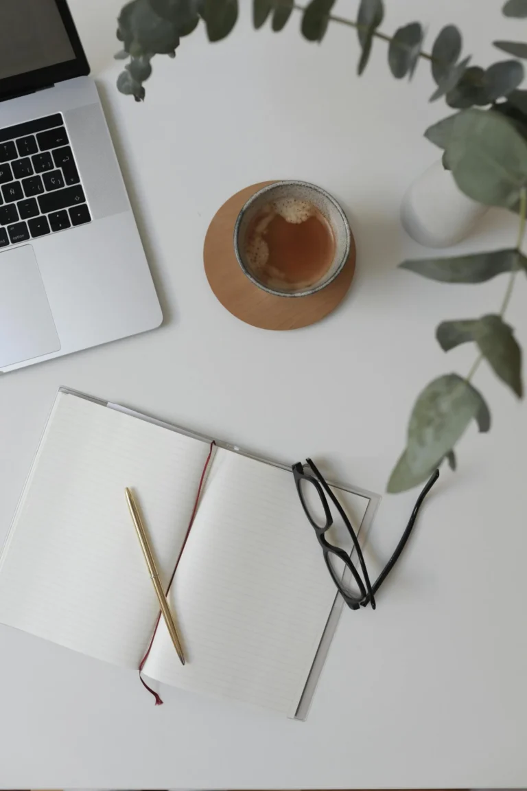 tea with laptop , notepad, pen and plant on a desktop, Startup Strategy & Timeline​